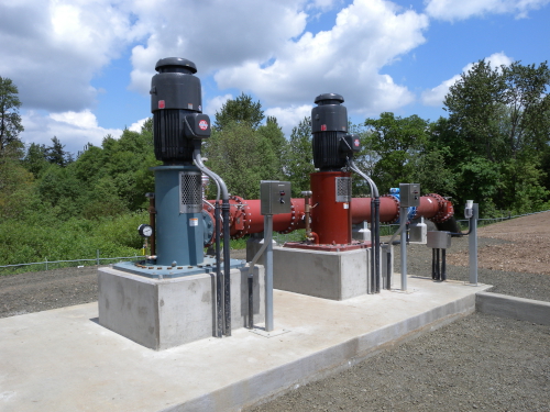 Vertical pumps on outdoor concrete plinths at Talking Waters